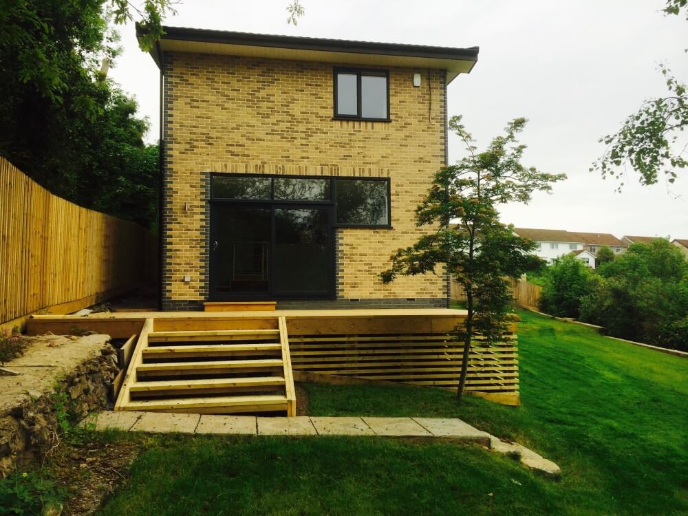 Side aspect of New build house at Worlebury Hill with Wooden steps to decking area