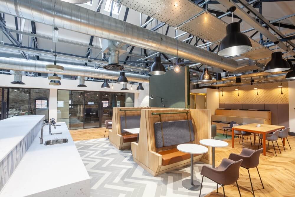 Kitchen and eating area with overhead exposed pipework for modern look